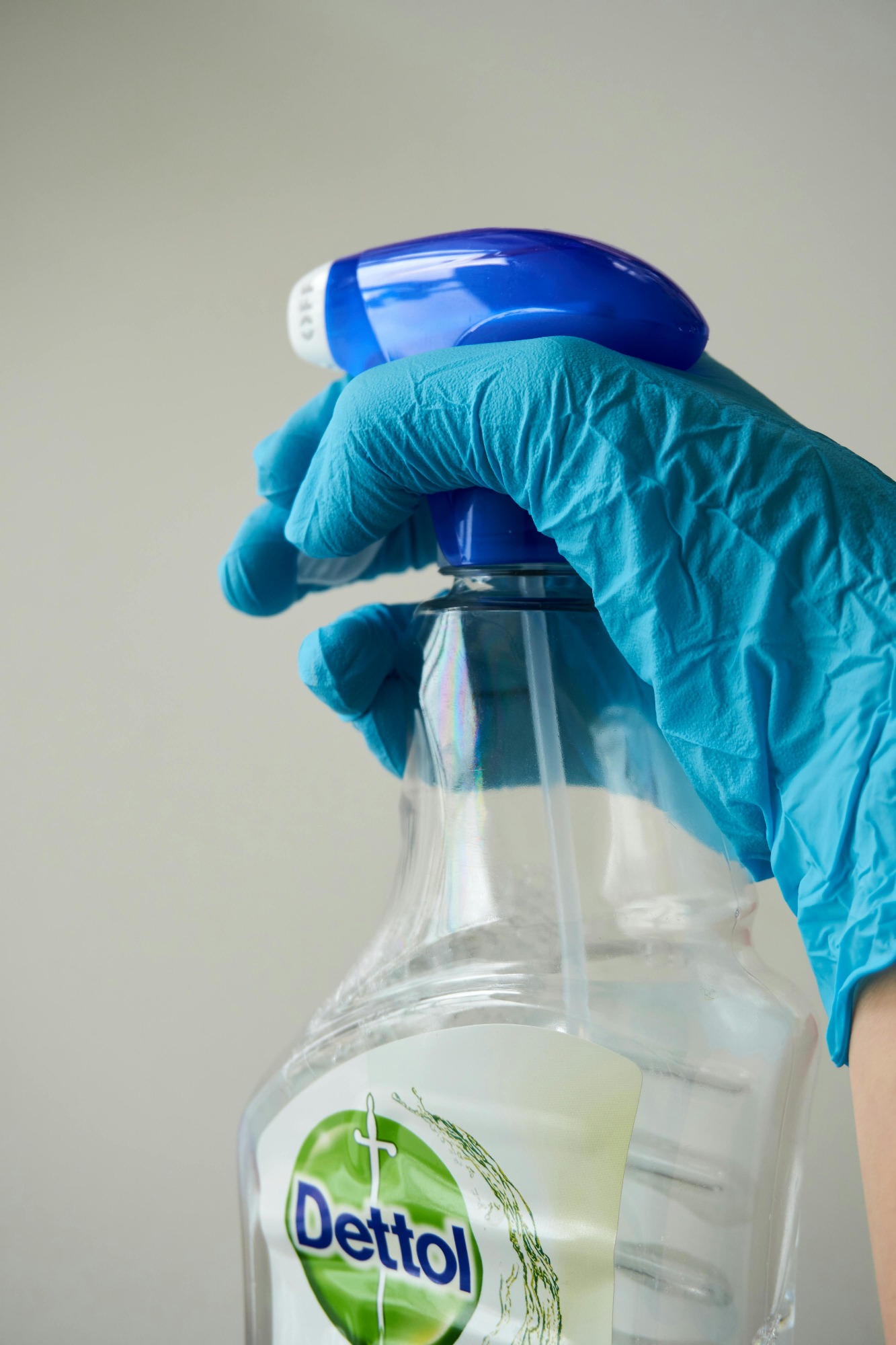 Sanitizing high-touch surfaces in a North York condo with a hospital-grade disinfectant spray.
